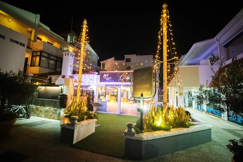 Gill's Restaurant entrance at Marina Bay Square at night