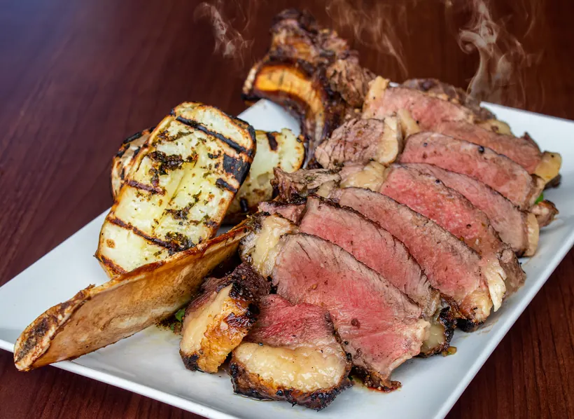 Sliced tomahawk steak at Gill's Restaurant Gibraltar